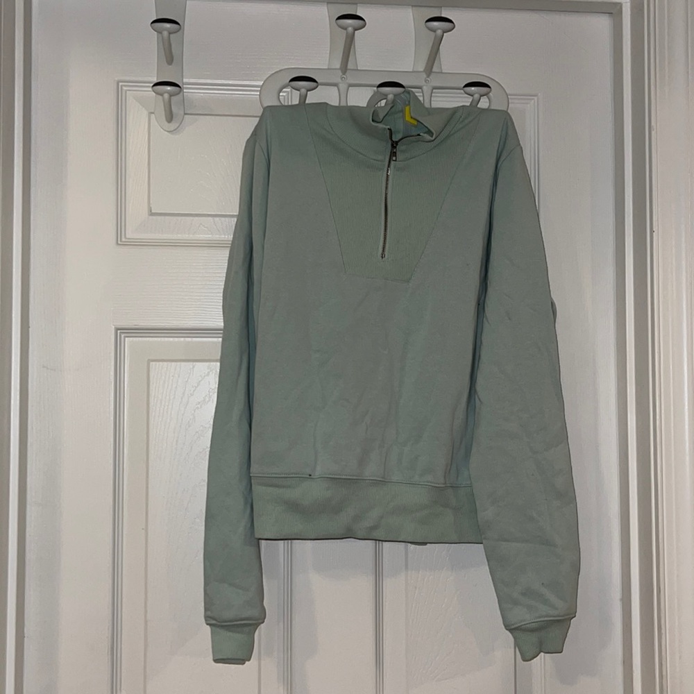 Quarter zip long sleeve sweatshirt teal in color